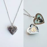 Heart-shaped locket with a cat inside on a white background
