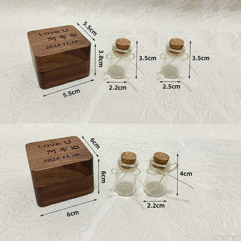 Wooden box and glass bottles with cork lids on a textured white background