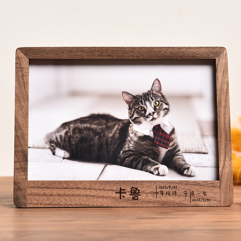 Wooden photo frame with a cat inside, featuring a wooden border.