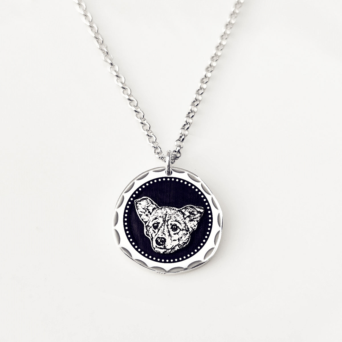 Necklace with a pendant featuring a wolf design on a white background