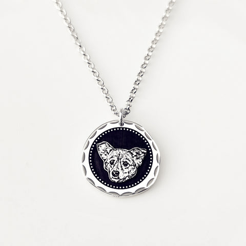 Necklace with a pendant featuring a wolf design on a white background