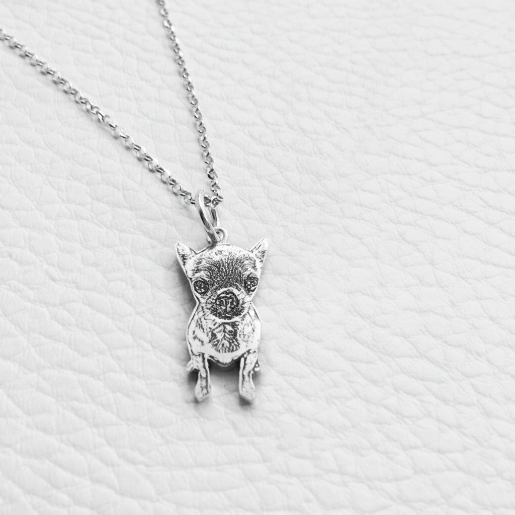 Silver pig pendant necklace on a light gray textured background