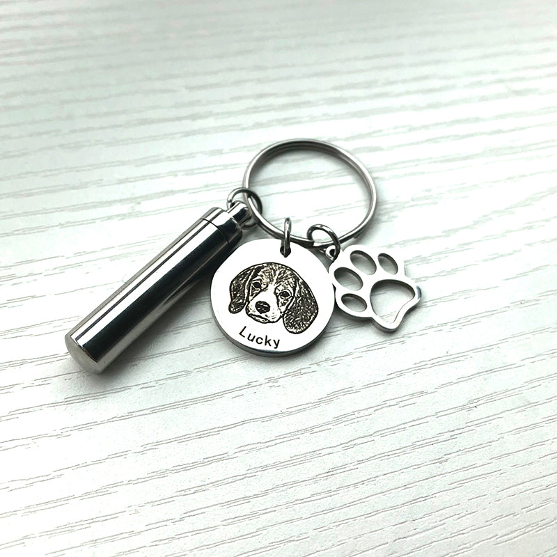 Keychain with pet urn and engraved tag on a white background