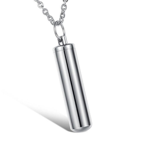 Silver cylindrical pendant necklace on a white background