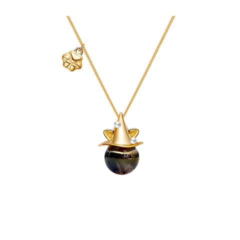Gold necklace with a unique pendant on a white background