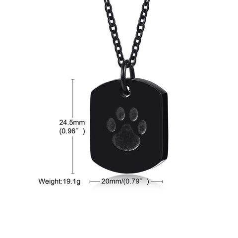 Black dog tag pendant with paw print design and measurements on a white background