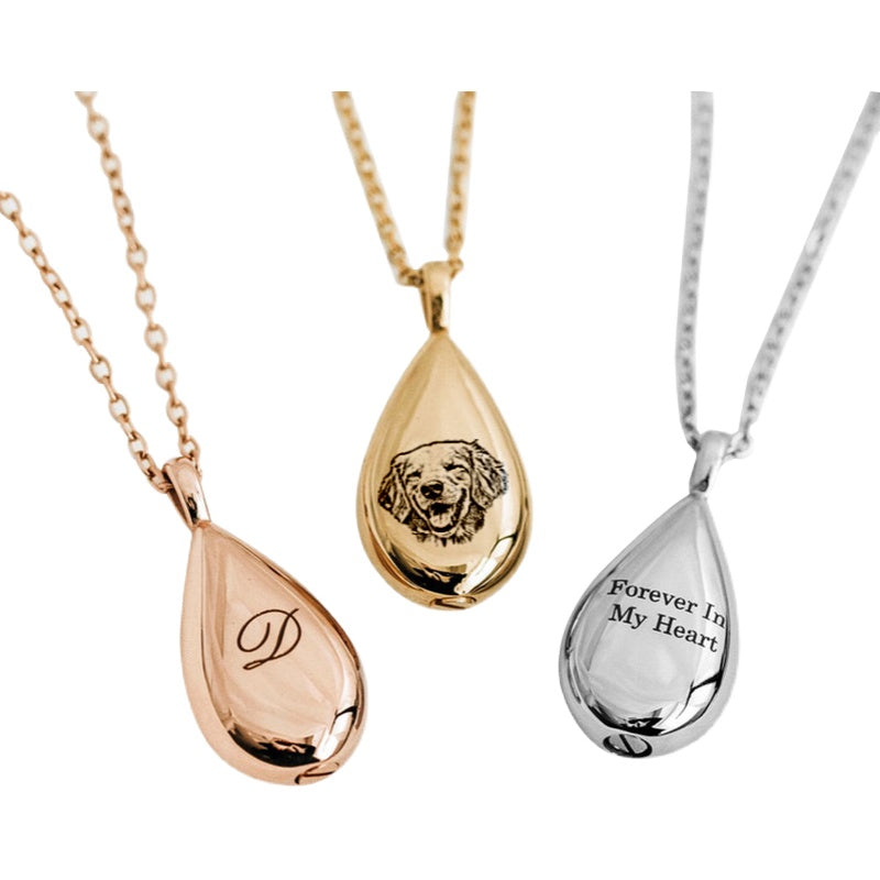 Three teardrop-shaped pendants in rose gold, yellow gold, and silver on white backgrounds.
