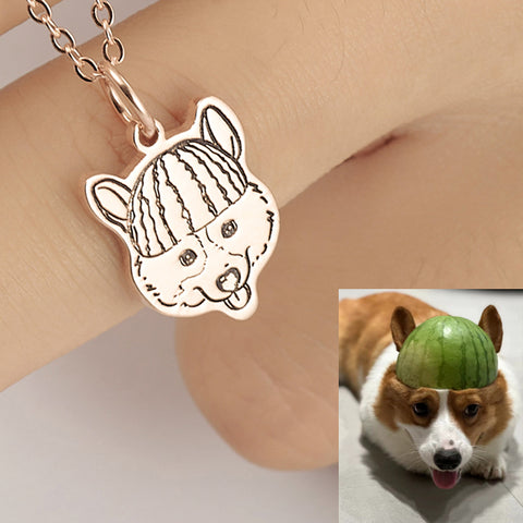 Dog-shaped pendant on a chain with a dog wearing a watermelon slice on its head.