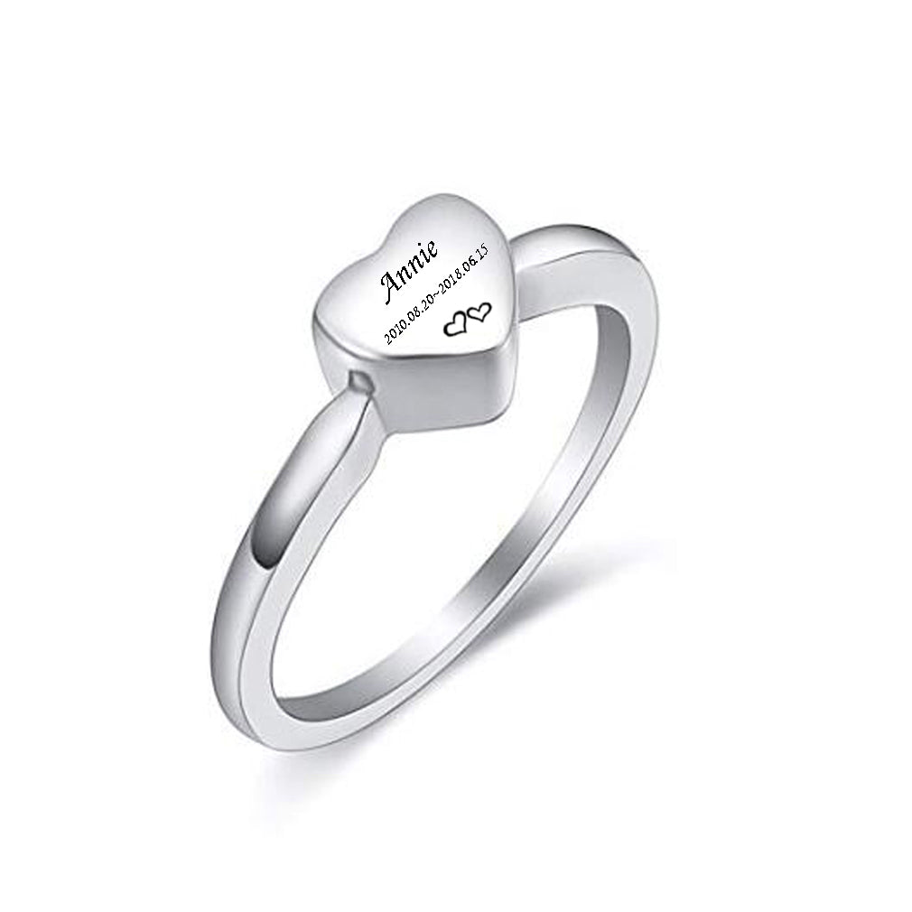 Silver ring with a heart-shaped engraved nameplate on a white background